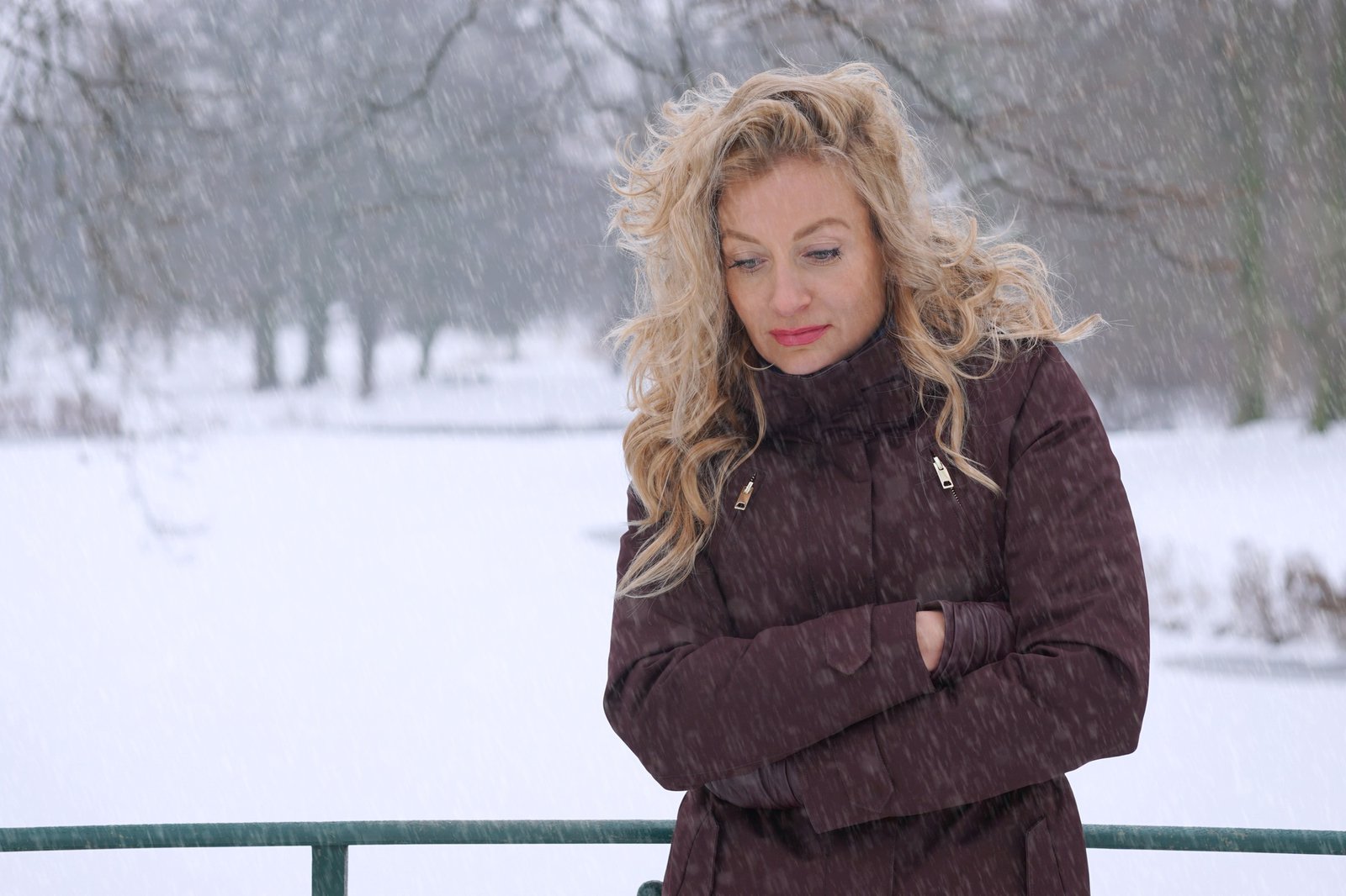 sad woman freezing in winter